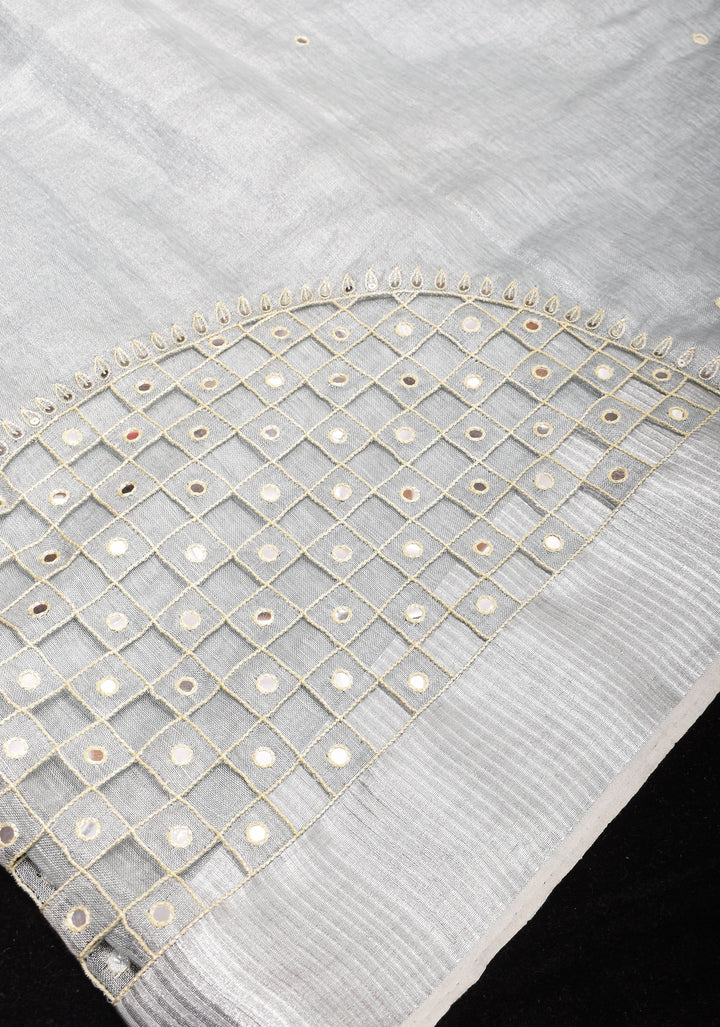 Cutwork and Mirror Work Tissue Linen Saree in White Silver with dramatic tassels
