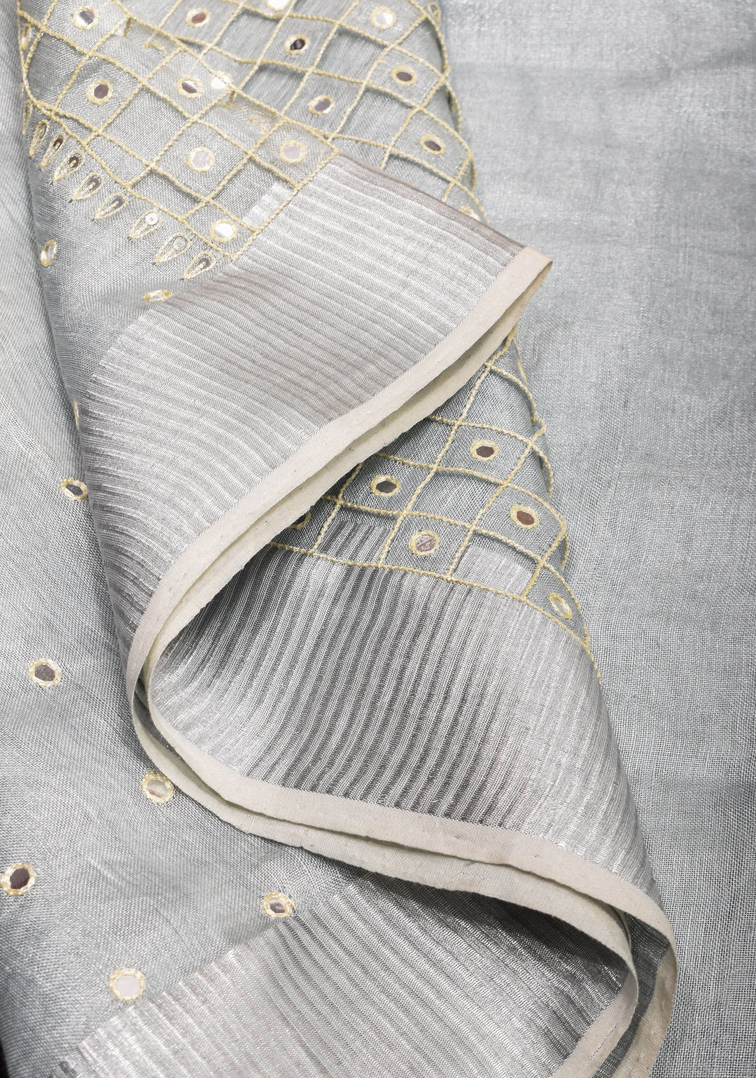 Cutwork and Mirror Work Tissue Linen Saree in White Silver with dramatic tassels
