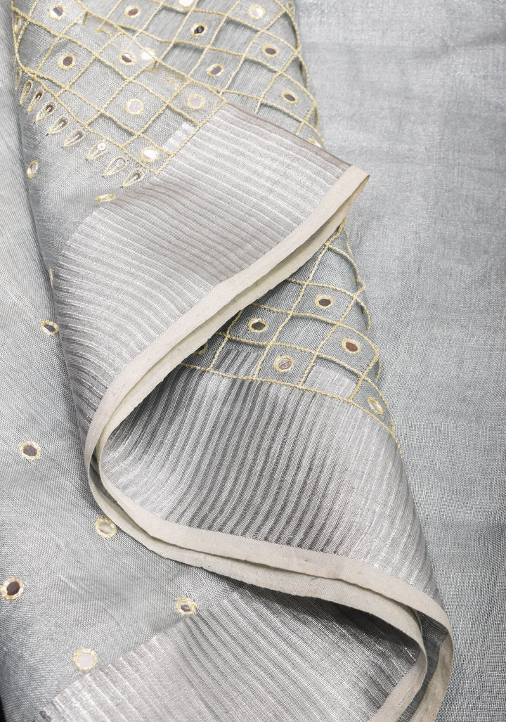 Cutwork and Mirror Work Tissue Linen Saree in White Silver with dramatic tassels