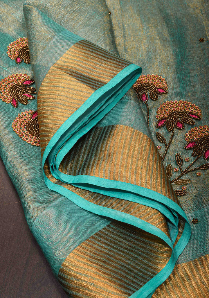 Pre order Hand Beadwork on Tissue Linen Saree in Blue with Gold Tissue