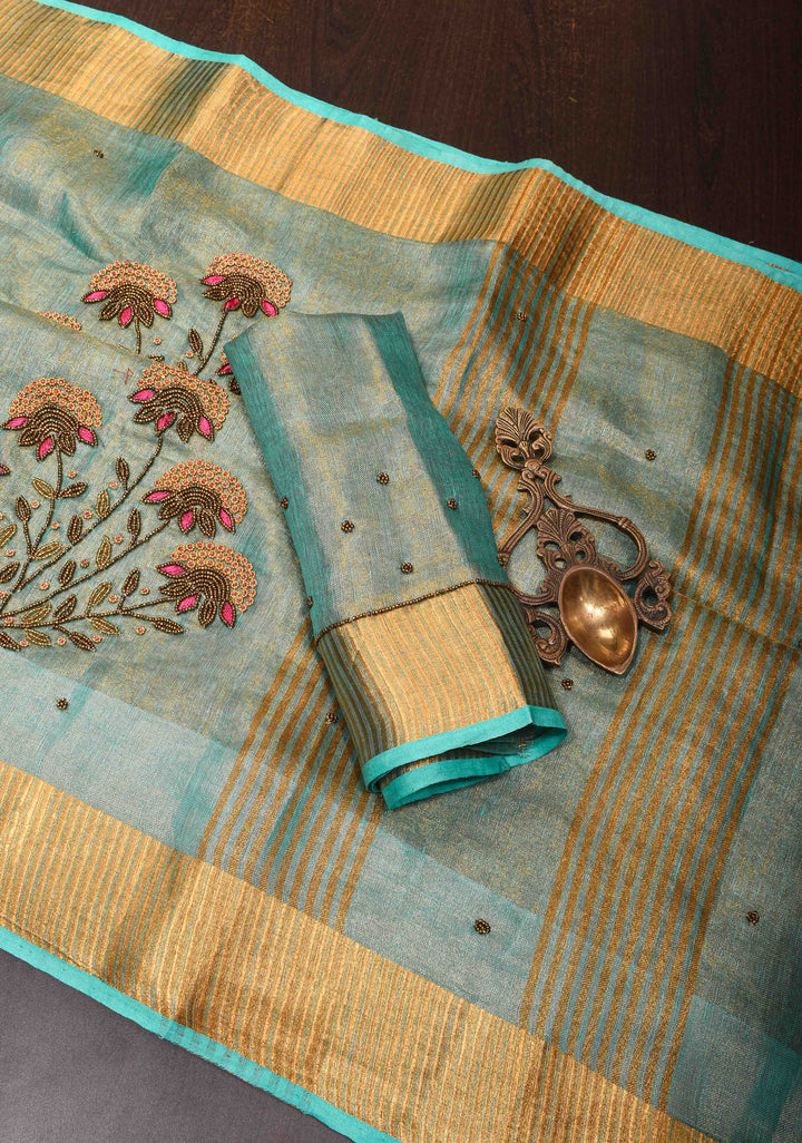 Pre order Hand Beadwork on Tissue Linen Saree in Blue with Gold Tissue