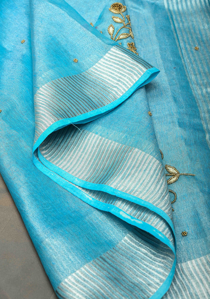 Hand Beadwork on Tissue Linen Saree in Sky Blue with Silver Tissue