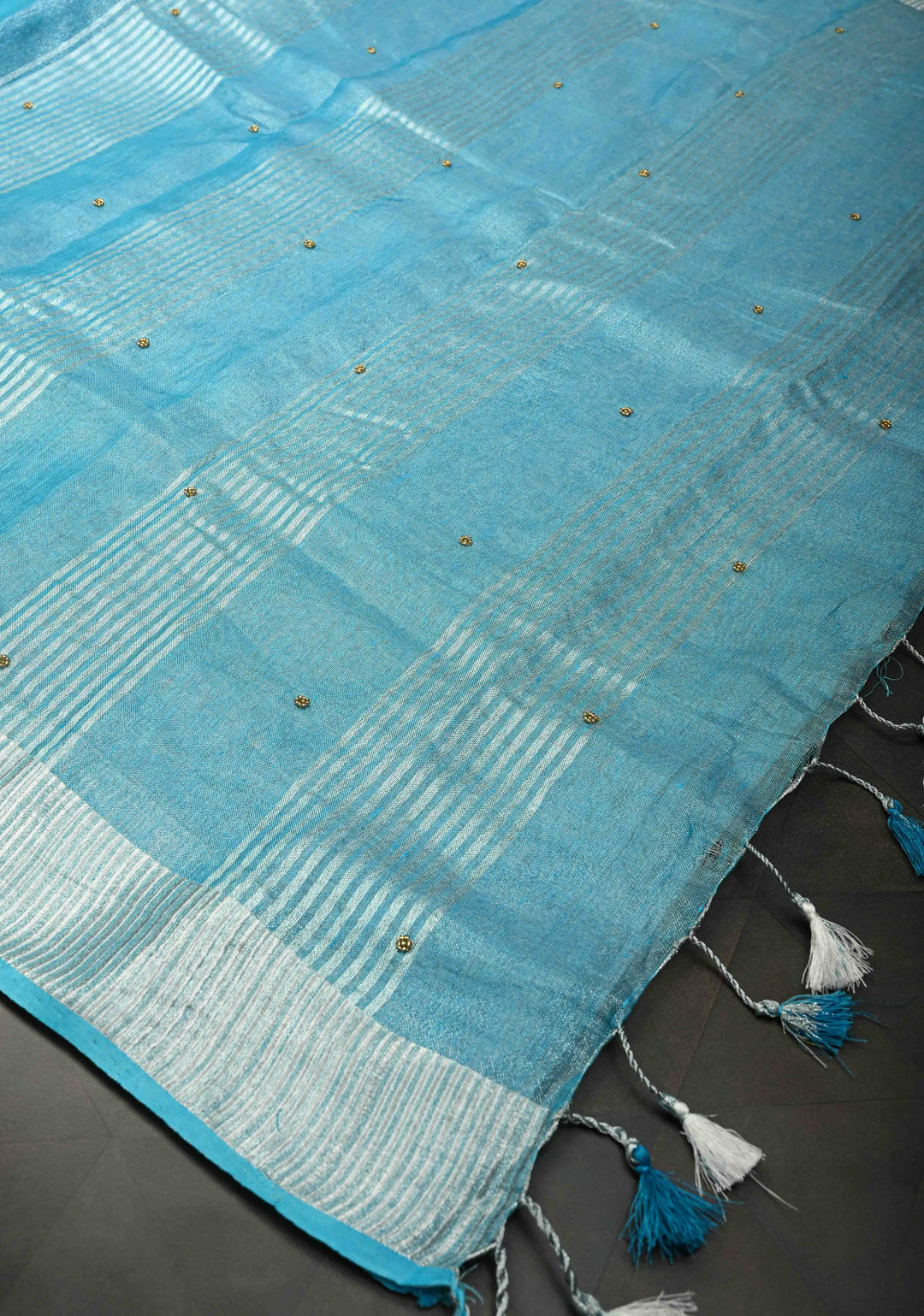 Hand Beadwork on Tissue Linen Saree in Sky Blue with Silver Tissue