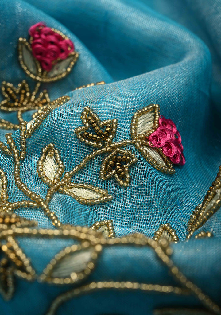 Hand Beadwork on Tissue Linen Saree in Sky Blue with Silver Tissue