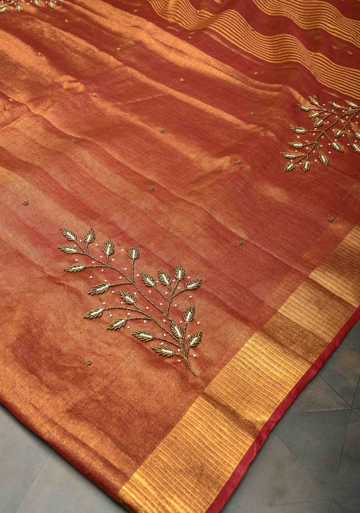 Golden Tissue Linen Saree in Reddish-Brown with Bead Embellishments