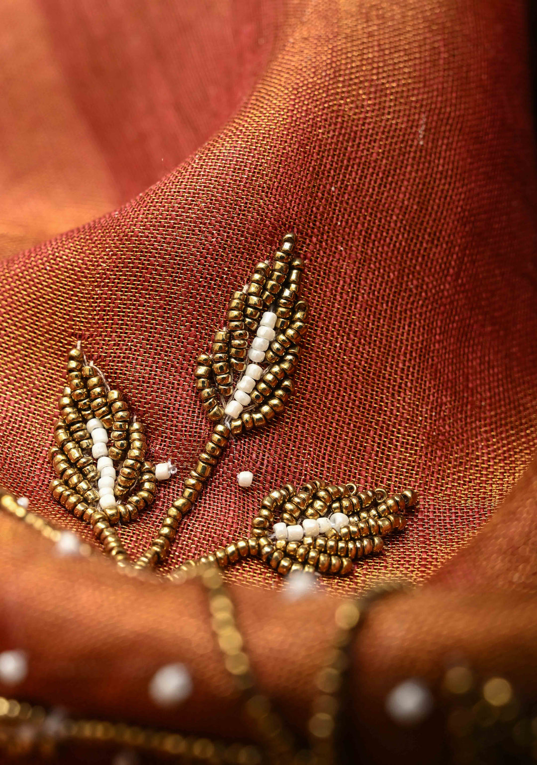 Golden Tissue Linen Saree in Reddish-Brown with Bead Embellishments