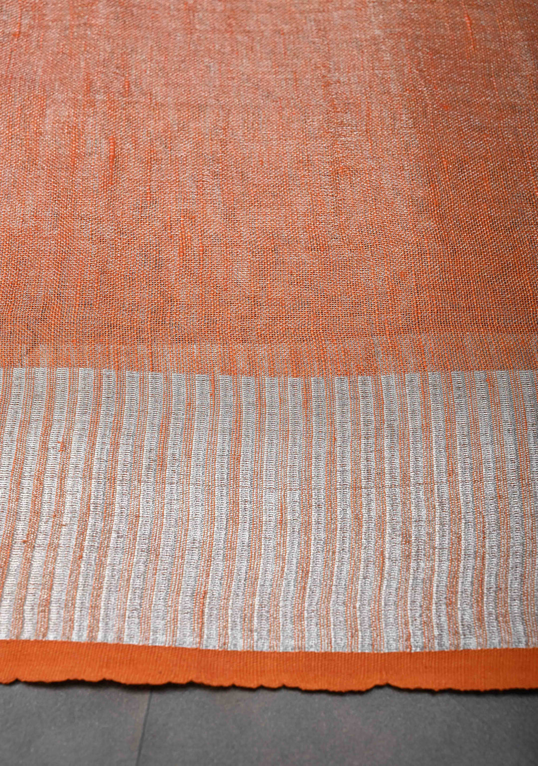 Orange Tissue Linen Saree with Silver Zari Border