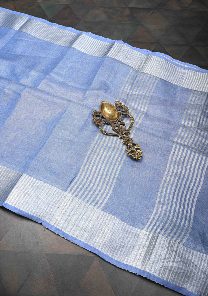Light Blue Tissue Linen Saree With Silver Zari Border