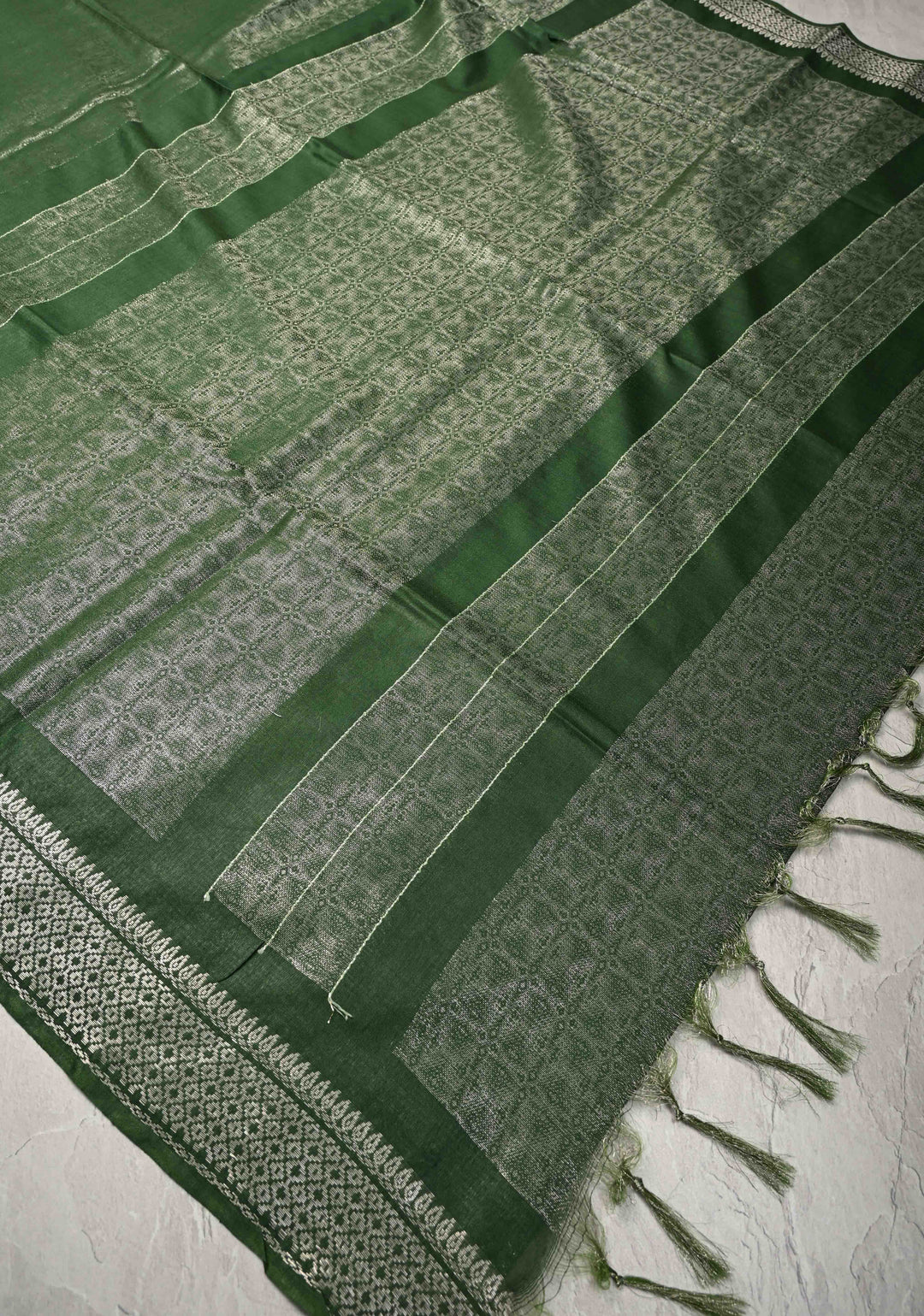 Dark Green Semi Tussar Tissue Silk Saree with Zari Border