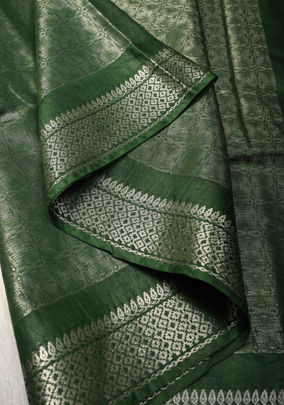 Dark Green Semi Tussar Tissue Silk Saree with Zari Border
