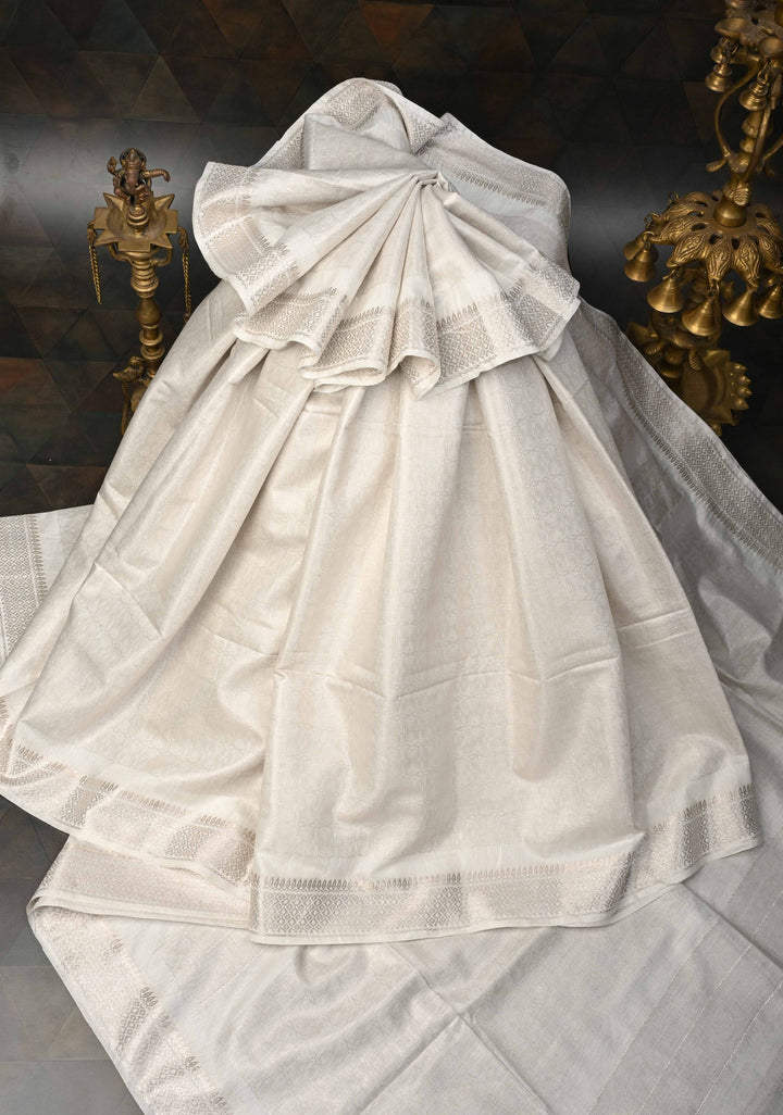 White Semi Tussar Tissue Silk Saree with Zari Border