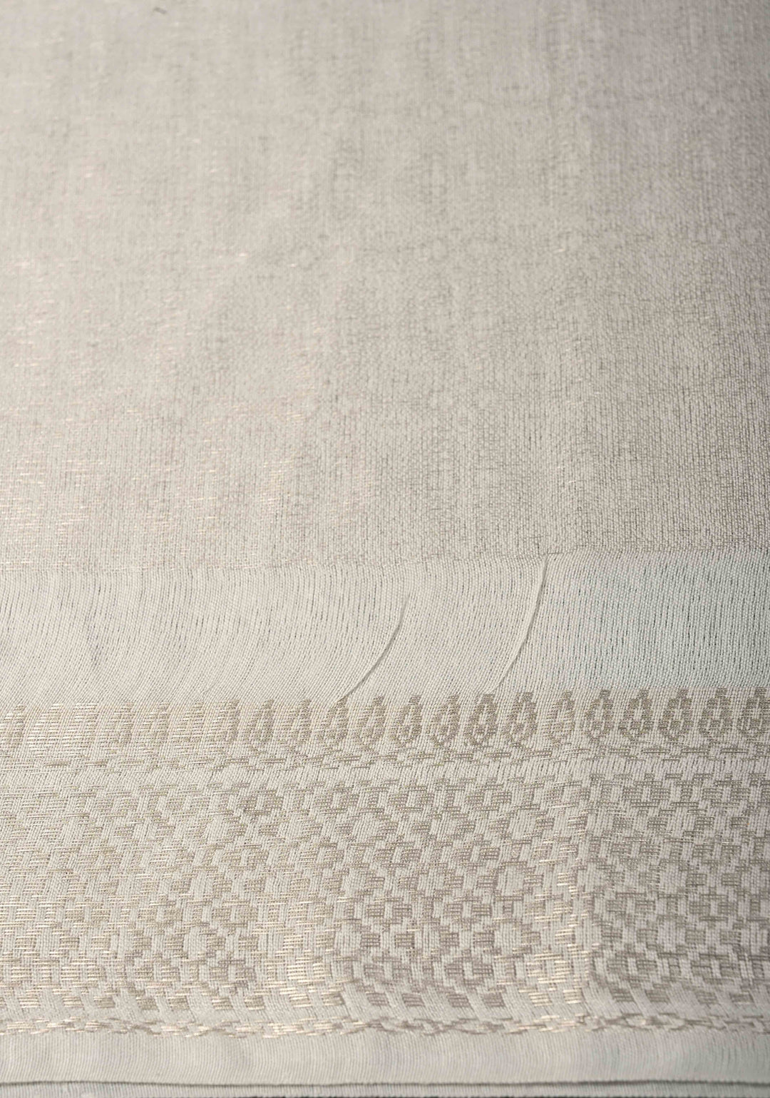 White Semi Tussar Tissue Silk Saree with Zari Border