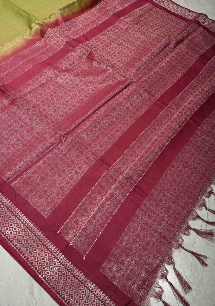 Olive Green Semi Tussar Tissue Saree with Contrast Silver Zari Border