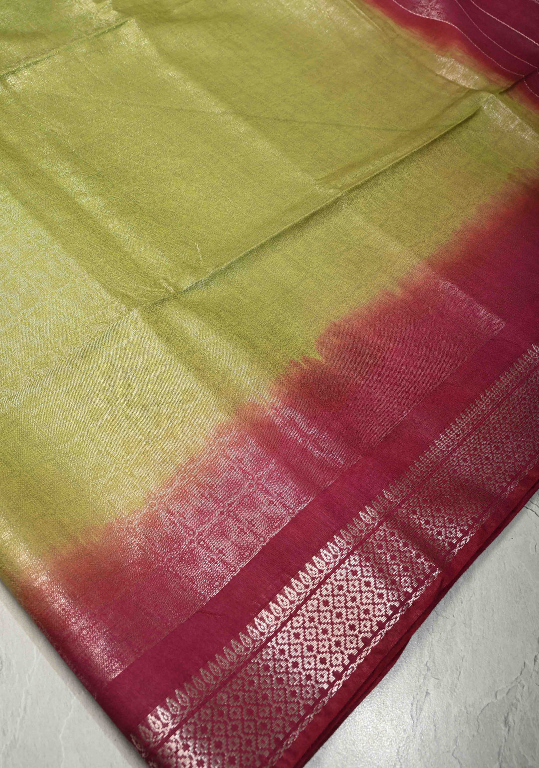 Olive Green Semi Tussar Tissue Saree with Contrast Silver Zari Border