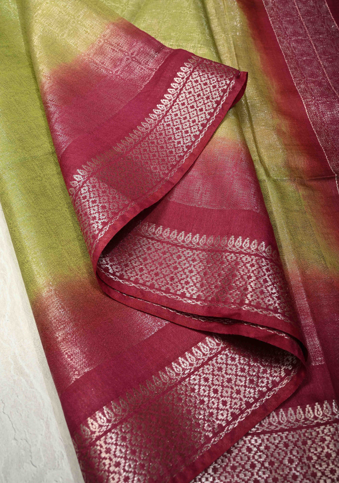 Olive Green Semi Tussar Tissue Saree with Contrast Silver Zari Border