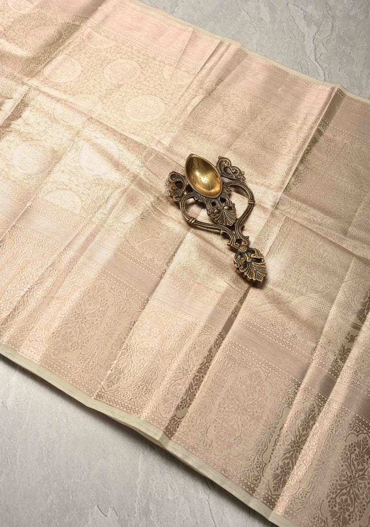 Beige Kanjivaram Tissue Semi Silk Saree with Floral Brocade and Zari Border