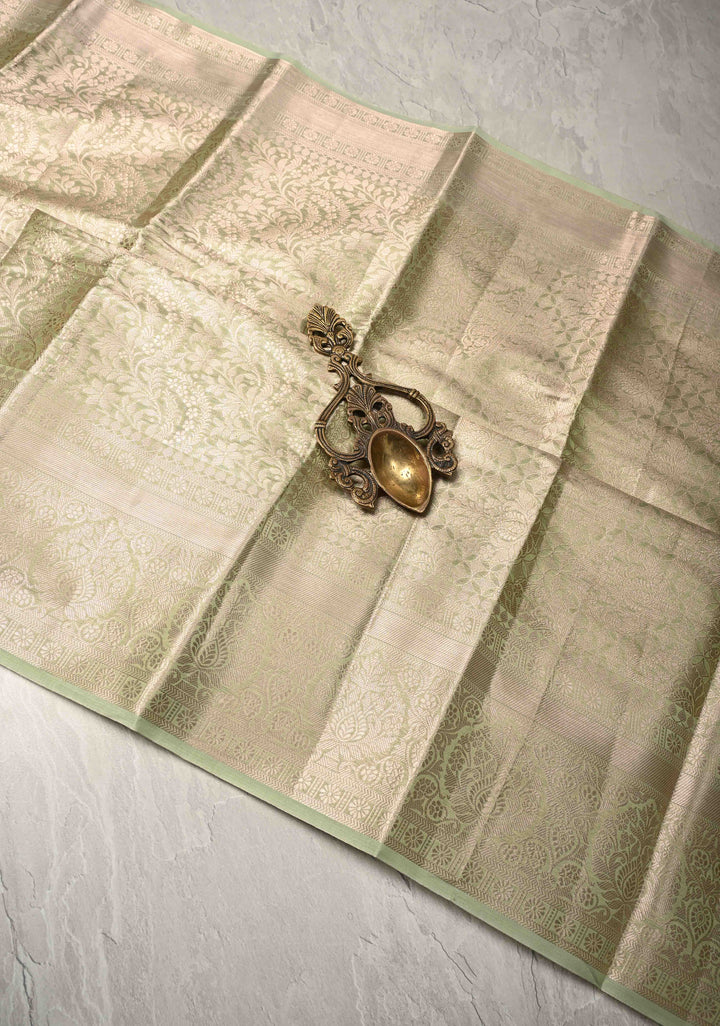 Pale Lime Green Kanjivaram Tissue Semi Silk Saree with Floral Brocade and Zari Border