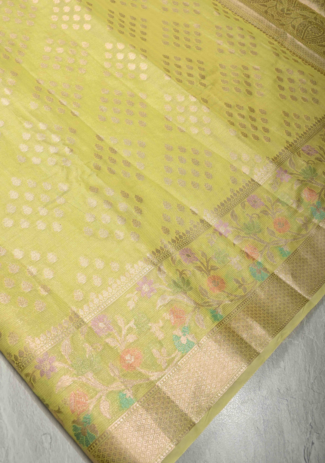 Lime Green Tissue Kanjivaram Semi Silk Saree with Leaf Buttas and Pastel meenakari Vine border