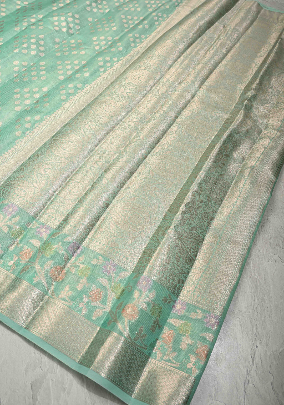Mint Green Tissue Kanjivaram Semi Silk Saree with Leaf Buttas and Pastel meenakari Vine border