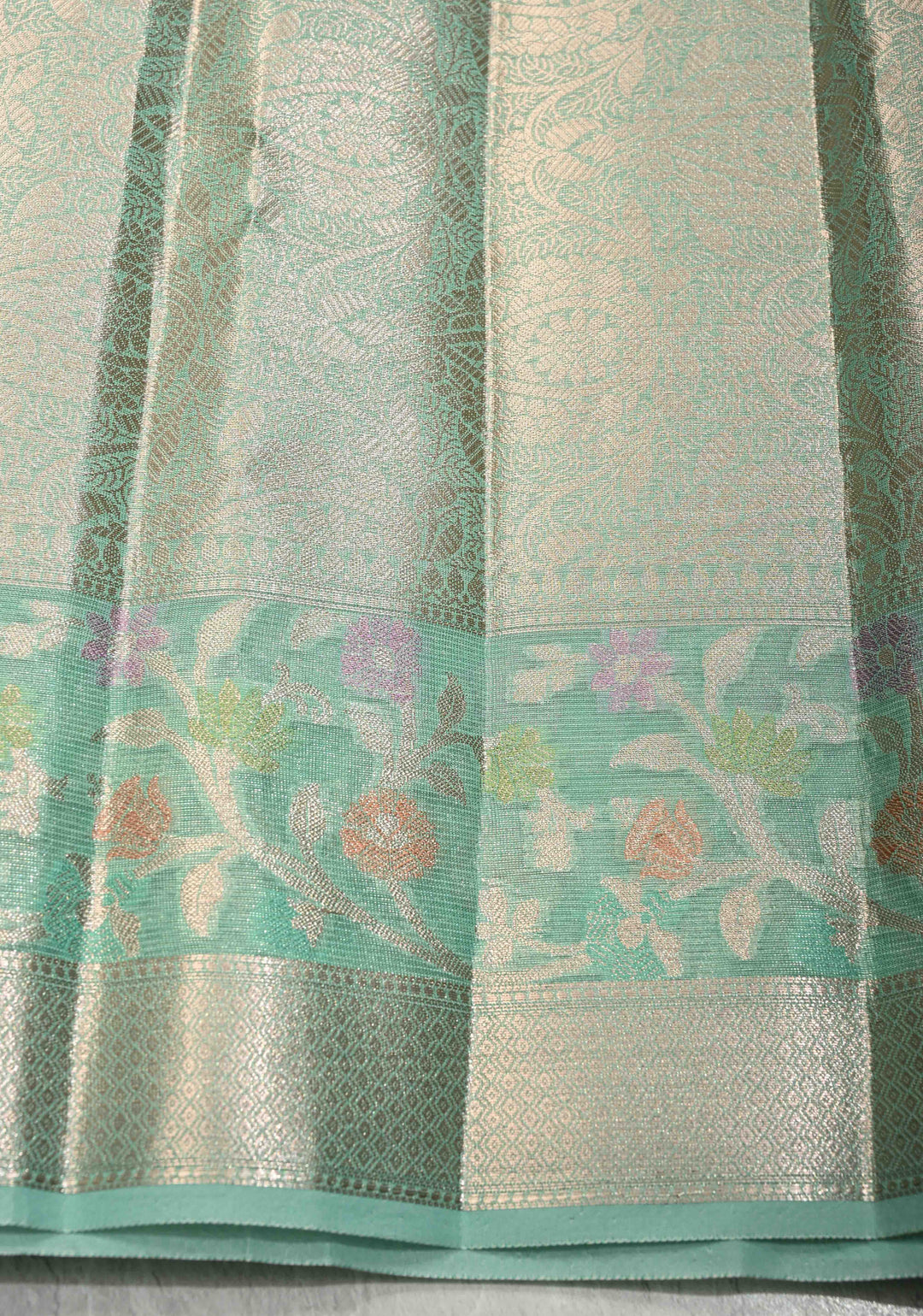 Mint Green Tissue Kanjivaram Semi Silk Saree with Leaf Buttas and Pastel meenakari Vine border