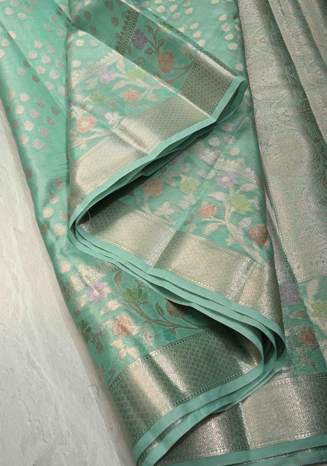 Mint Green Tissue Kanjivaram Semi Silk Saree with Leaf Buttas and Pastel meenakari Vine border