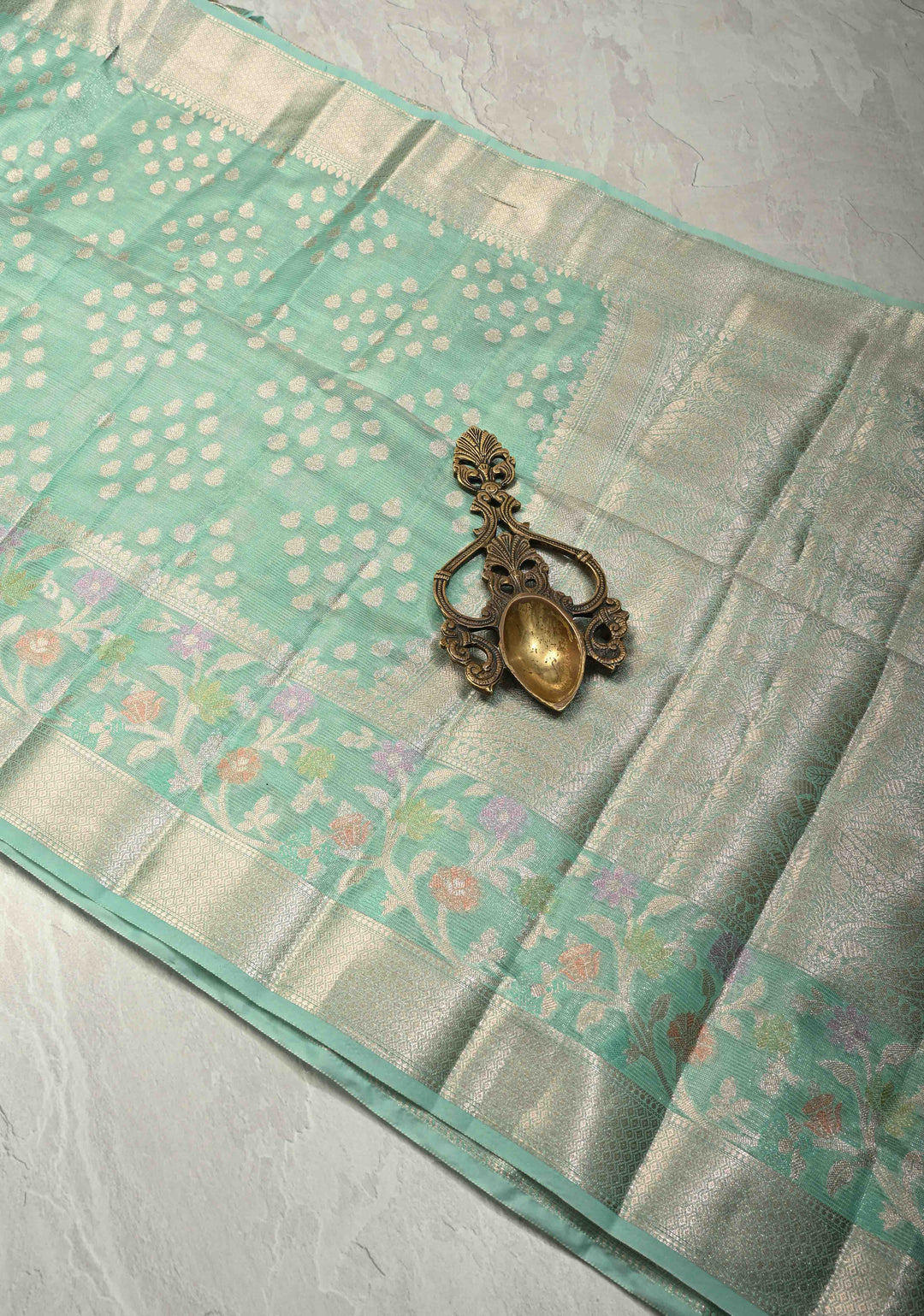 Mint Green Tissue Kanjivaram Semi Silk Saree with Leaf Buttas and Pastel meenakari Vine border