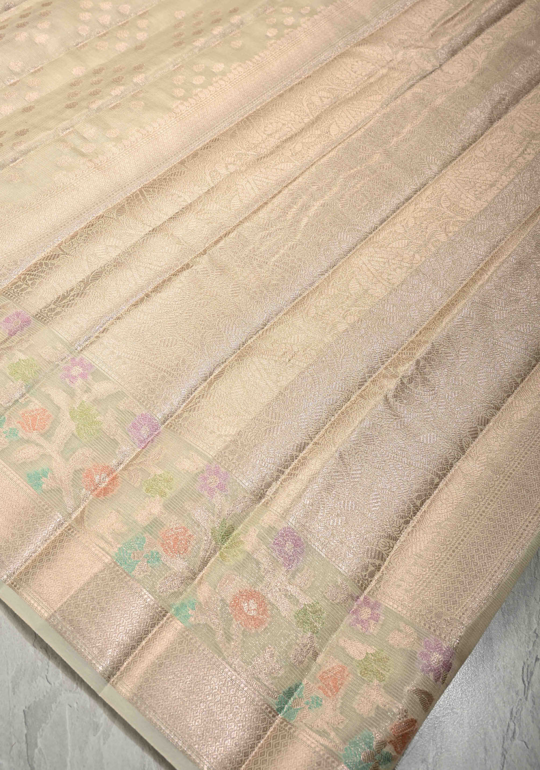Ivory Tissue Kanjivaram Semi Silk Saree with  Leaf Buttas and Pastel meenakari Vine border