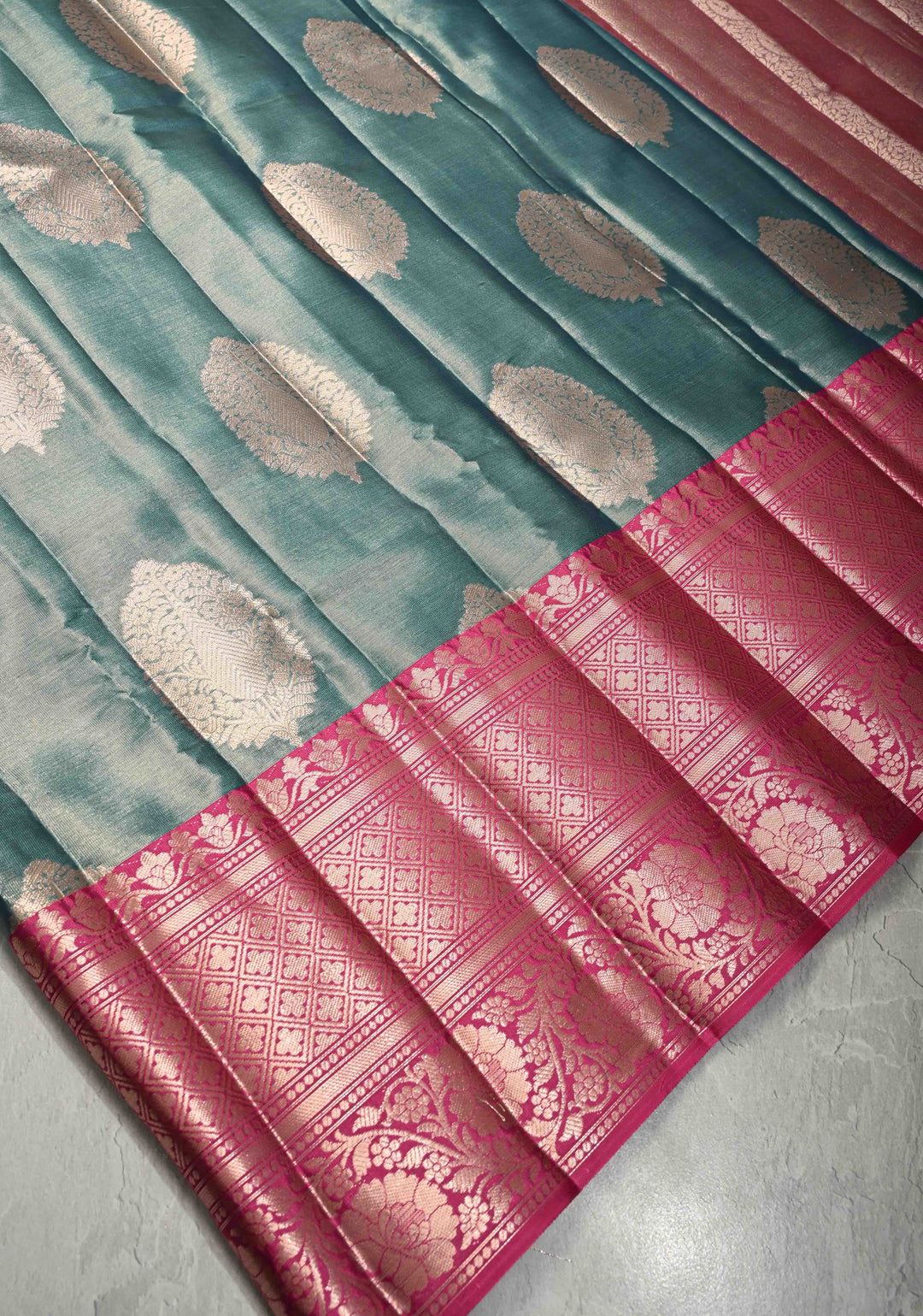Teal Blue Tissue Kanjivaram Semi Silk Saree with Large Floral Zari Buttas and Pink Floral Wide Border