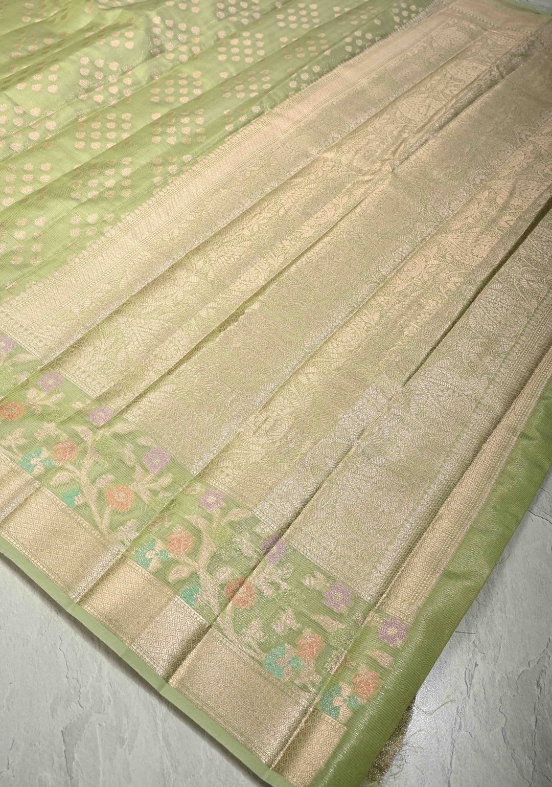 Light olive Green Tissue Kanjivaram Semi Silk Saree with Leaf Buttas and Pastel meenakari Vine border