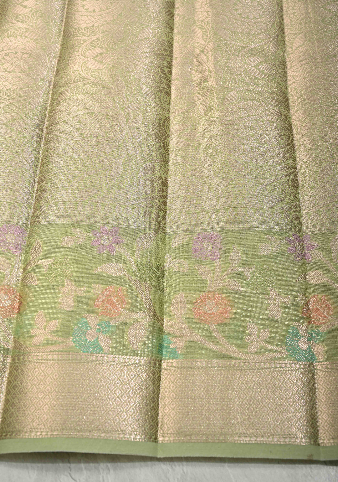 Light olive Green Tissue Kanjivaram Semi Silk Saree with Leaf Buttas and Pastel meenakari Vine border