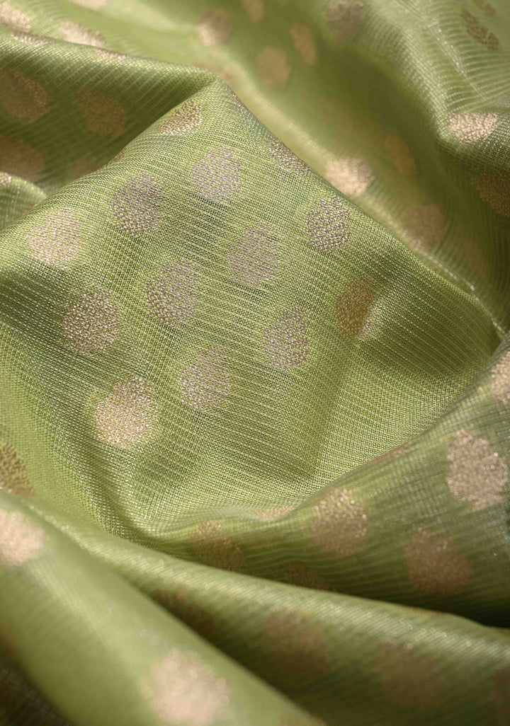 Light olive Green Tissue Kanjivaram Semi Silk Saree with Leaf Buttas and Pastel meenakari Vine border