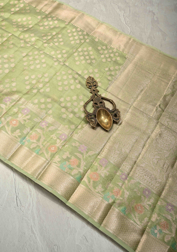 Light olive Green Tissue Kanjivaram Semi Silk Saree with Leaf Buttas and Pastel meenakari Vine border