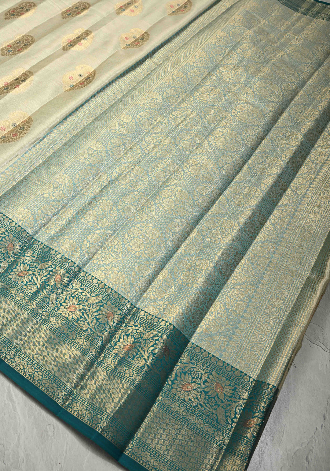 Beige Kanjivaram Tissue Semi Silk Saree with Meenakari Paisley Zari Buttas and Contrast Zari Border