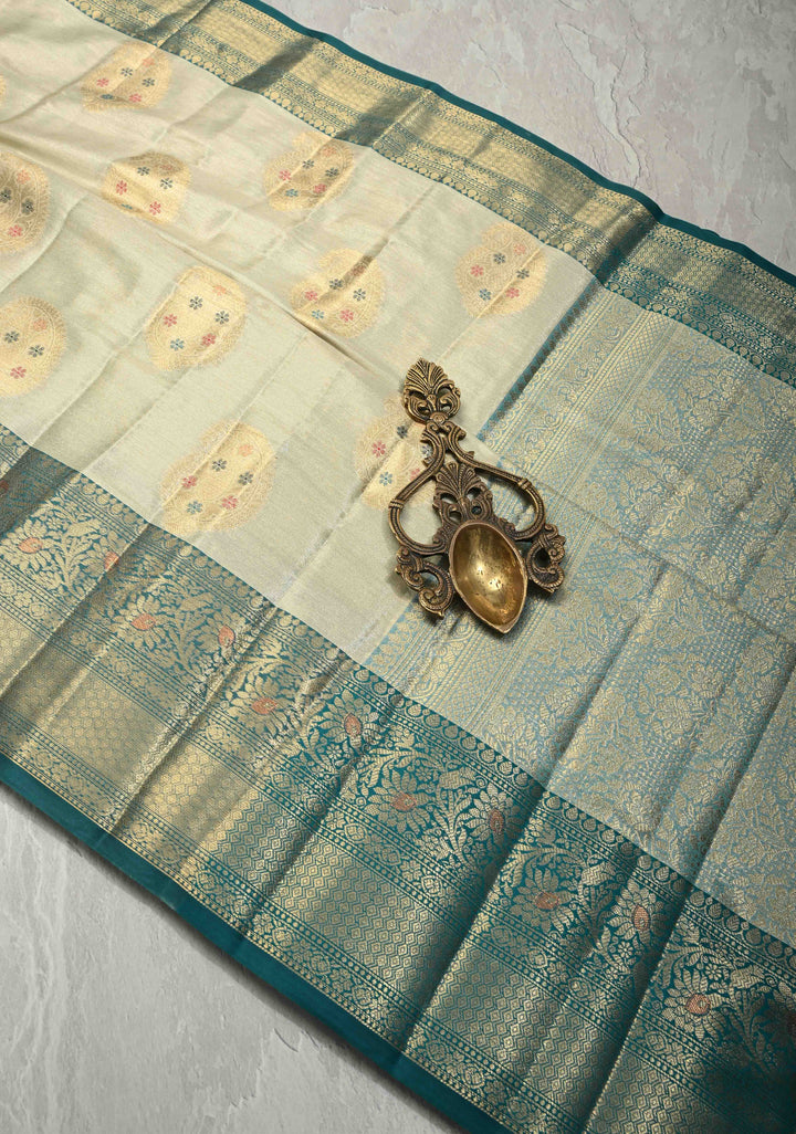 Beige Kanjivaram Tissue Semi Silk Saree with Meenakari Paisley Zari Buttas and Contrast Zari Border
