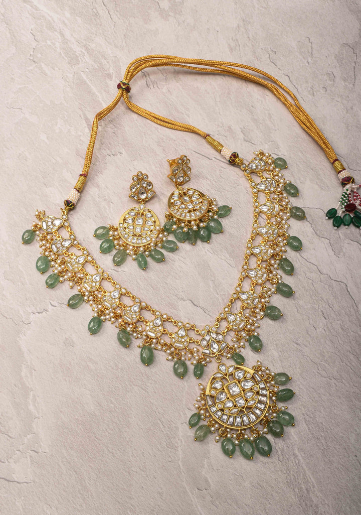 Statement Kundan Necklace Set with Circular Pendant and Green Bead Accents