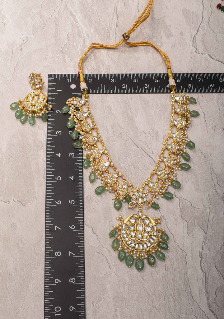 Statement Kundan Necklace Set with Circular Pendant and Green Bead Accents