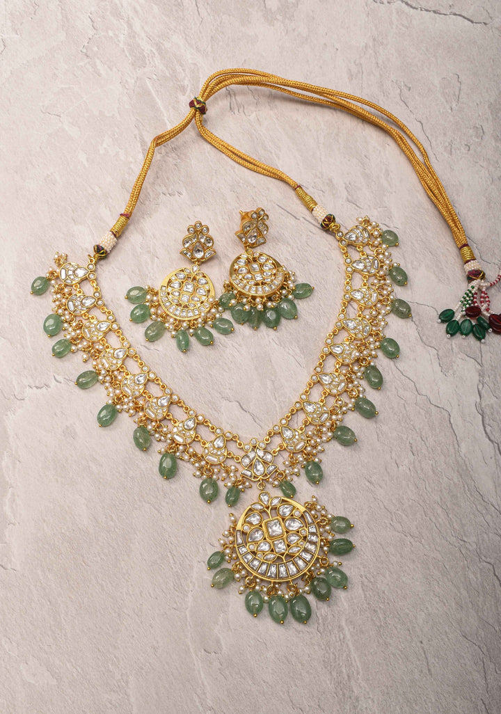 Statement Kundan Necklace Set with Circular Pendant and Green Bead Accents