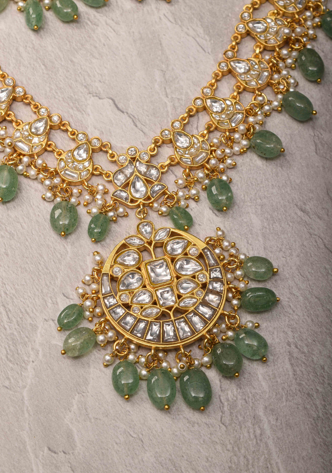 Statement Kundan Necklace Set with Circular Pendant and Green Bead Accents