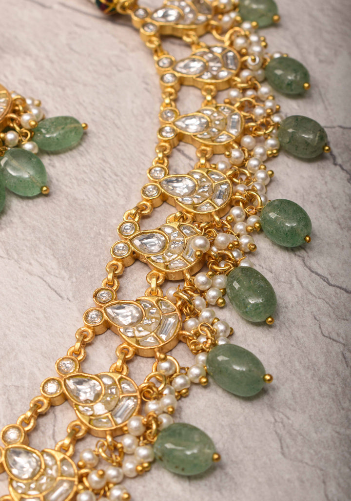 Statement Kundan Necklace Set with Circular Pendant and Green Bead Accents