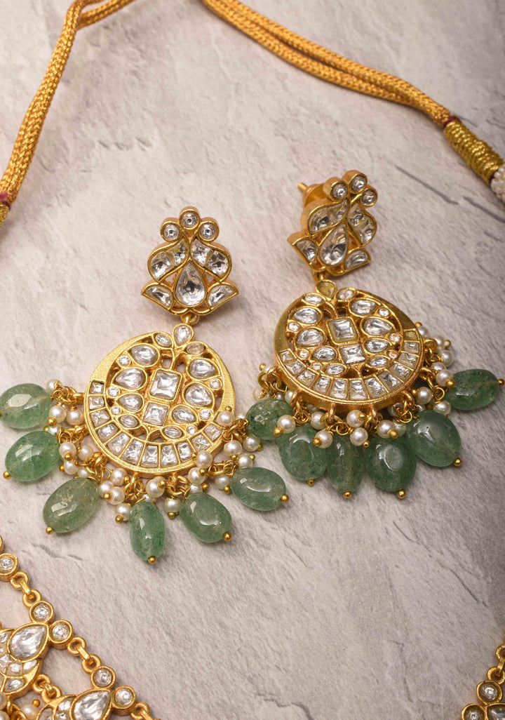 Statement Kundan Necklace Set with Circular Pendant and Green Bead Accents