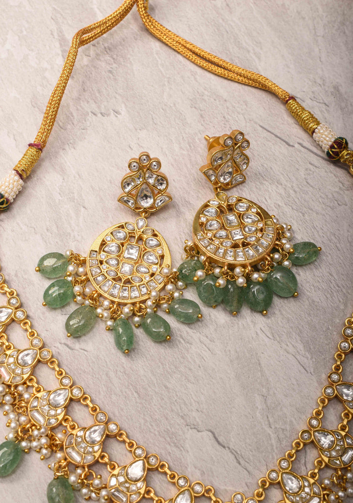 Statement Kundan Necklace Set with Circular Pendant and Green Bead Accents