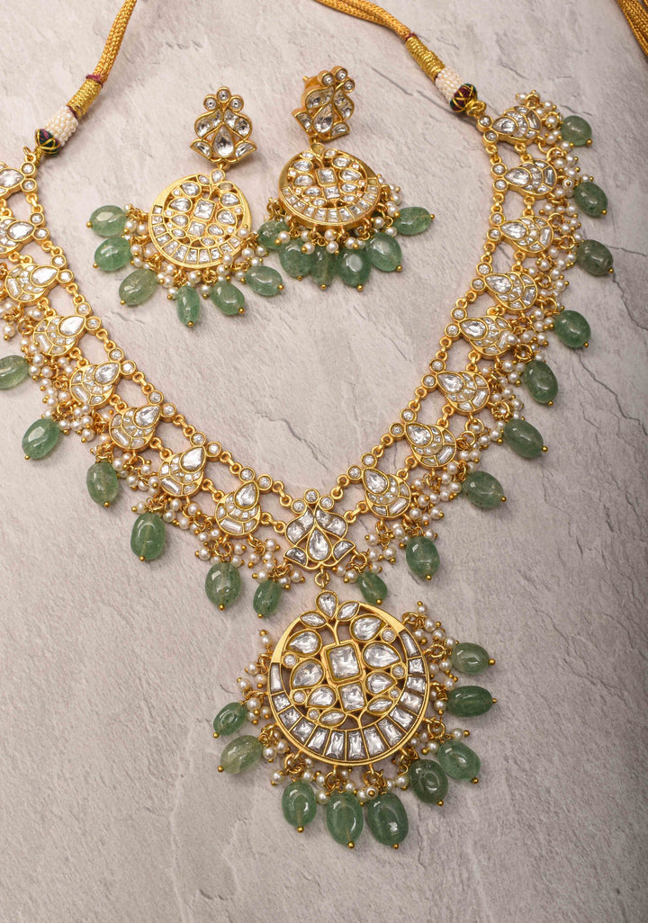 Statement Kundan Necklace Set with Circular Pendant and Green Bead Accents