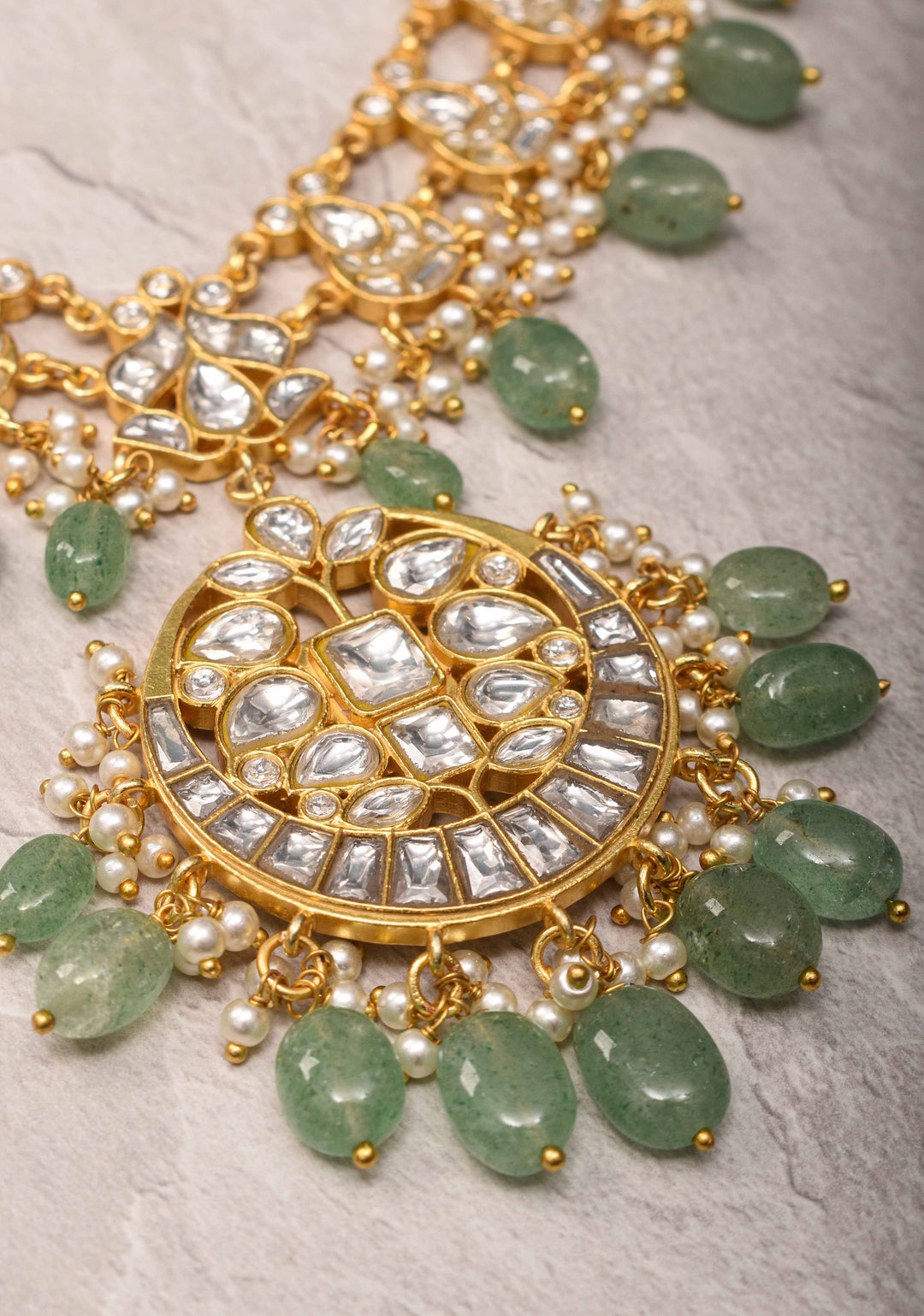 Statement Kundan Necklace Set with Circular Pendant and Green Bead Accents