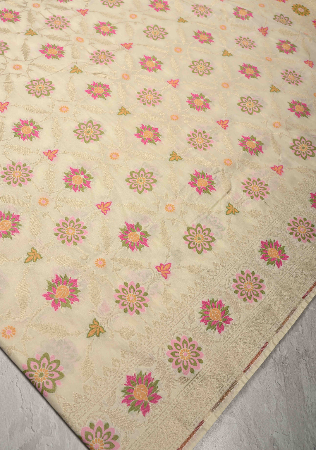 Ivory Moroccan Jaal on Semi Silk Saree with Floral Meenakari Buttas and Zari Border