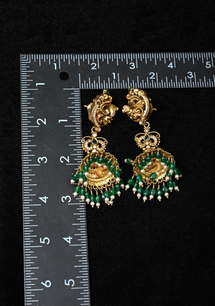 Preorder : 92.5 Silver, 22 kt Gold-Plated Jhumka Earrings with Peacock and Floral Motifs