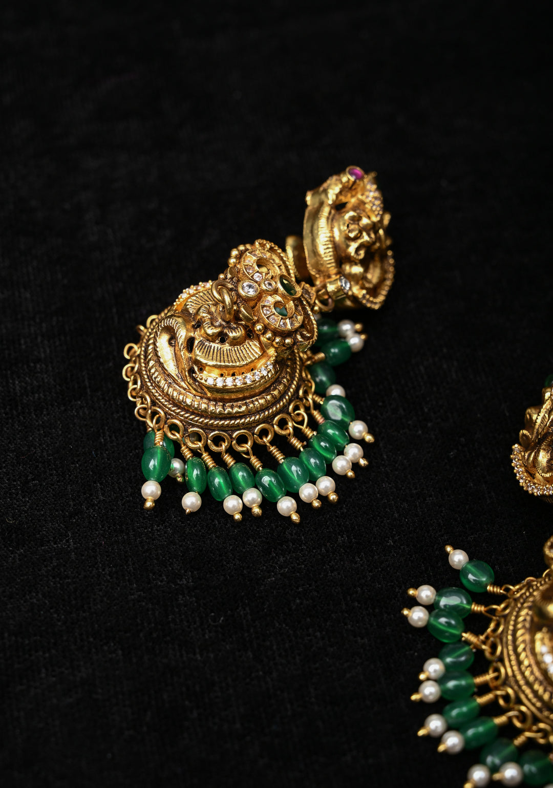 Preorder : 92.5 Silver, 22 kt Gold-Plated Jhumka Earrings with Peacock and Floral Motifs