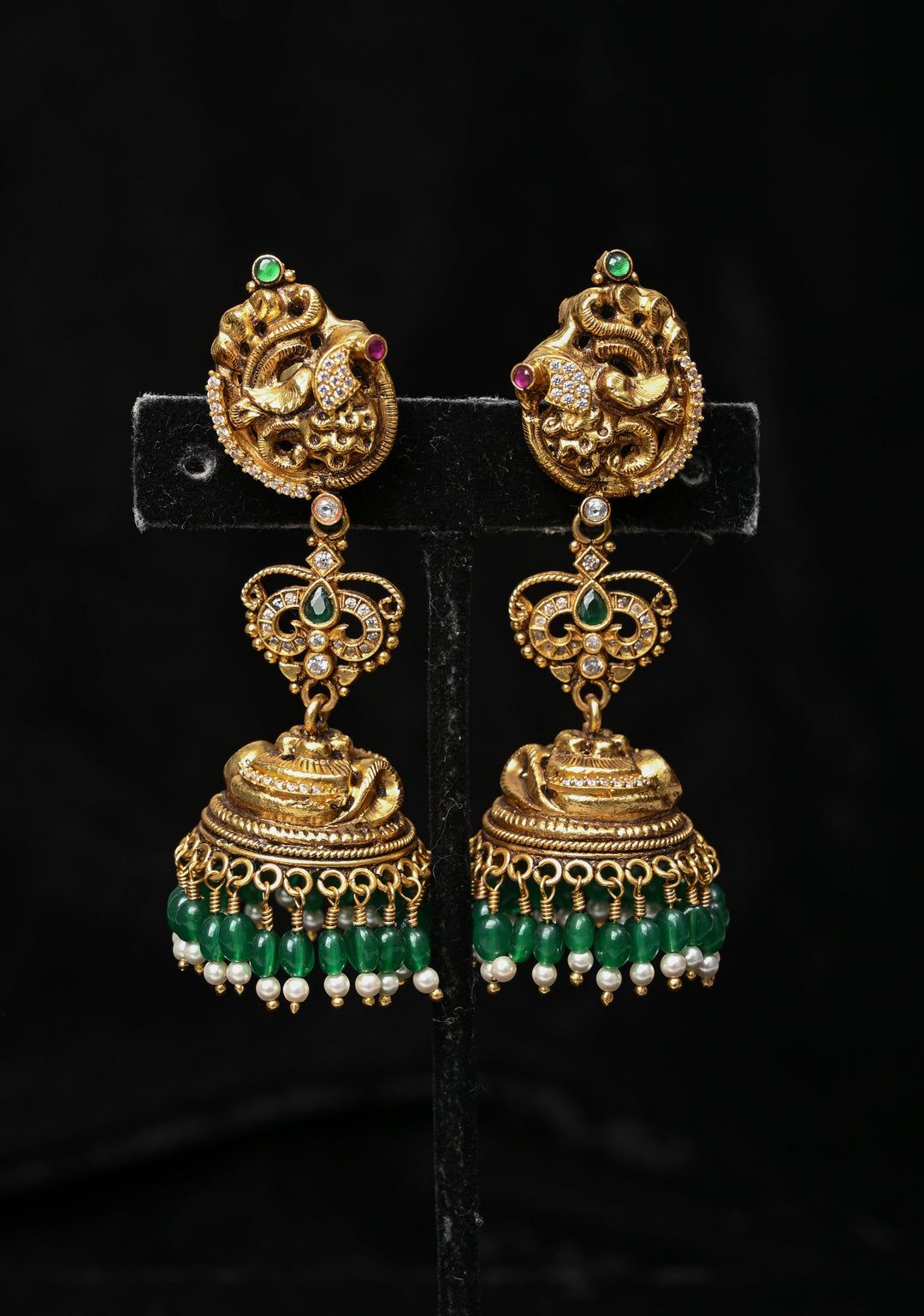 Preorder : 92.5 Silver, 22 kt Gold-Plated Jhumka Earrings with Peacock and Floral Motifs