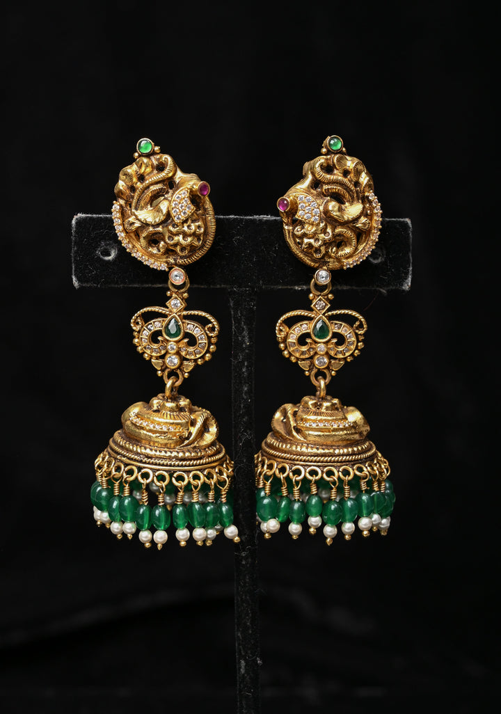 Preorder : 92.5 Silver, 22 kt Gold-Plated Jhumka Earrings with Peacock and Floral Motifs