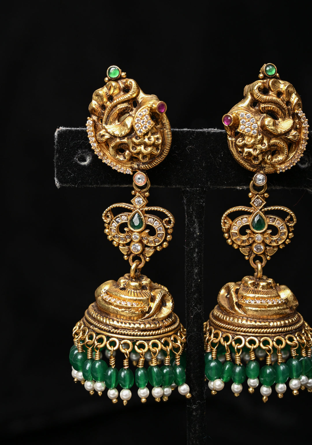 Preorder : 92.5 Silver, 22 kt Gold-Plated Jhumka Earrings with Peacock and Floral Motifs