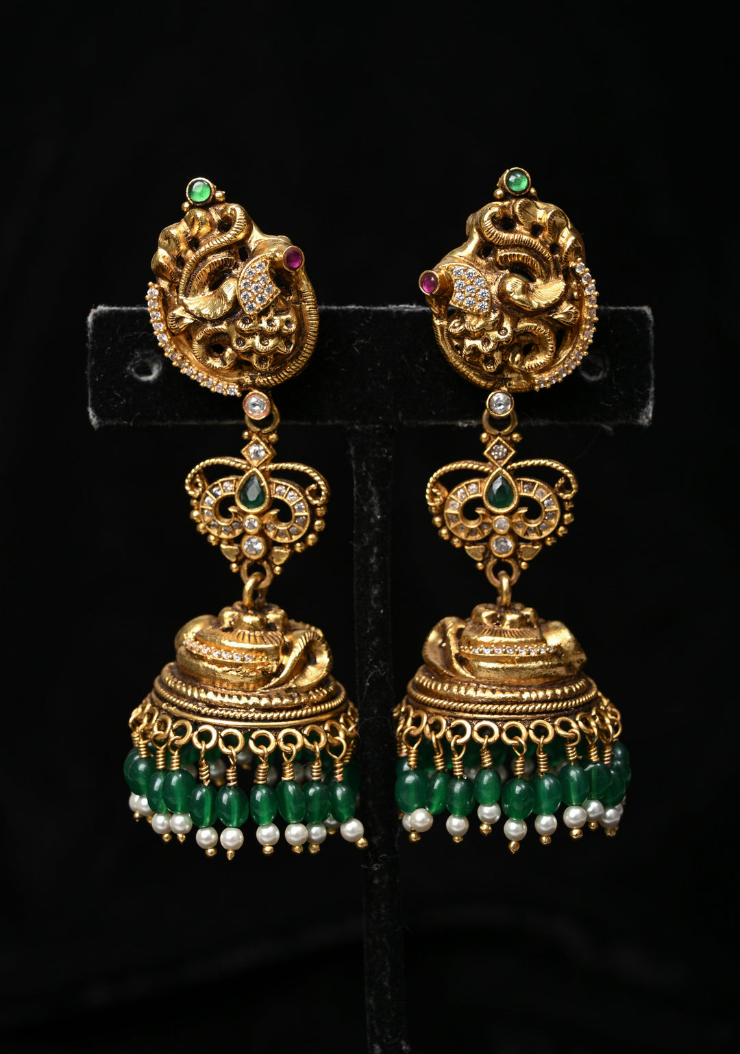 Preorder : 92.5 Silver, 22 kt Gold-Plated Jhumka Earrings with Peacock and Floral Motifs